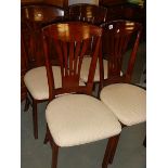A set of 4 good quality dining chairs.