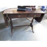 A mahogany sofa table.