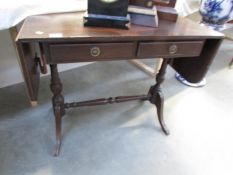 A mahogany sofa table.