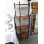 A Victorian mahogany inlaid 4 tier what not.