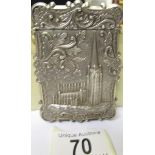 An unmarked white metal card case depicting Edinburgh Church and castle.