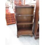 A free standing bookcase with drawer.