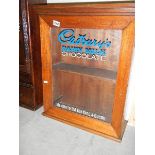 A 'Cadbury's Chocolate' advertising cabinet.