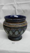 A heavily patterned Doulton Lambeth 1882 bulbous vase in blue, green,