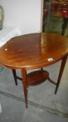 A oval mahogany inlaid occasional table.