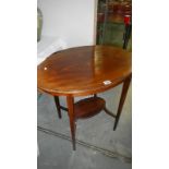 A oval mahogany inlaid occasional table.