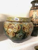 A Royal Doulton large jardiniere with floral design in subdued blue and ochre colours on a mottled