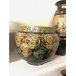 A Royal Doulton large jardiniere with floral design in subdued blue and ochre colours on a mottled