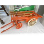 A hand made model of a cart.