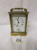 A French brass carriage clock with key.