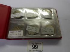 An album of foreign silver coins.