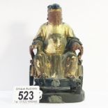 A late 18th / early 19th century carved wood Chinese seated figure, a/f.