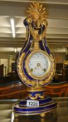 A Marie Antoinette fine porcelain lyre mantel clock, designed for V & A Museum.