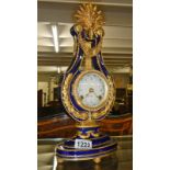 A Marie Antoinette fine porcelain lyre mantel clock, designed for V & A Museum.