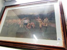 A large framed and glazed print of a rugby game after W.T.B.