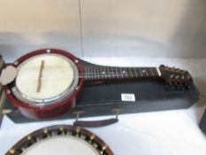 A model XXS 8 string banjo with case.