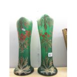 A pair of 19th century hand painted green glass vases with red and gold holly pattern, 16" tall.