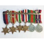 A set of 6 WW2 medals with ribbons and bar including one 'Mentioned in Dispatch' bar.
