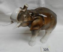 A Royal Dux elephant. Made in Czechoslovakia and hand painted. (Both tusks intact).