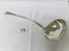 A Georgian silver soup ladle, London hall mark, makers mark WE/WF.