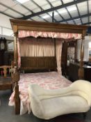 A superb quality four poster bed with carved post and linen carved headboard.