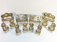 2 sets of Austrian enamel miniature furniture comprising 2 sofa's, 4 arm chairs,