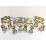 2 sets of Austrian enamel miniature furniture comprising 2 sofa's, 4 arm chairs,