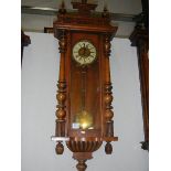 A mahogany Vienna wall clock.