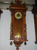 A mahogany Vienna wall clock.