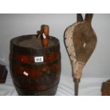 An oak barrel and a pair of bellows.