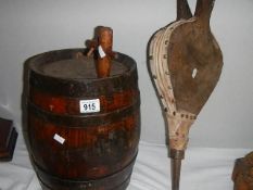 An oak barrel and a pair of bellows.