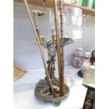 A cast metal stick stand with sticks.