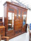 A mahogany combination wardrobe.