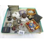 A tray of costume jewellery, pin badges, vesta etc.