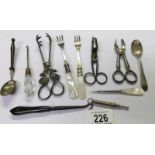 A mixed lot including sugar tongs, candle snuffer, pickle forks, silver spoon etc.