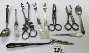 A mixed lot including sugar tongs, candle snuffer, pickle forks, silver spoon etc.