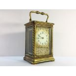 A French brass carriage clock with key (1 side glass a/f).