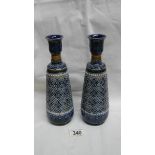 A pair of Doulton Lambeth 1878 vases, Harriet E Hibbut and Louisa Matterson.