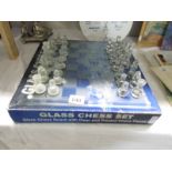 A boxed glass chess set.