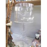 An acrylic table lamp.