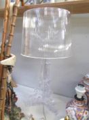 An acrylic table lamp.