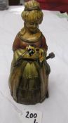 An Austrian cold painted spelter touch tip lighter in the form of a lady.