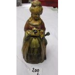 An Austrian cold painted spelter touch tip lighter in the form of a lady.