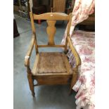 A commode chair.