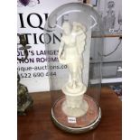 A marble figure of a semi nude lady A/F under glass dome.