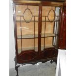 A mahogany display cabinet.