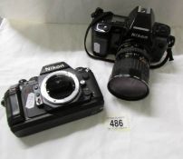 A Nikon F-8015 camera with lens and a Nikon F-501 camera body.