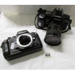 A Nikon F-8015 camera with lens and a Nikon F-501 camera body.