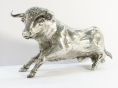 A silver model of a bull.