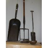 A collection of early tools including shovels, ladle etc.